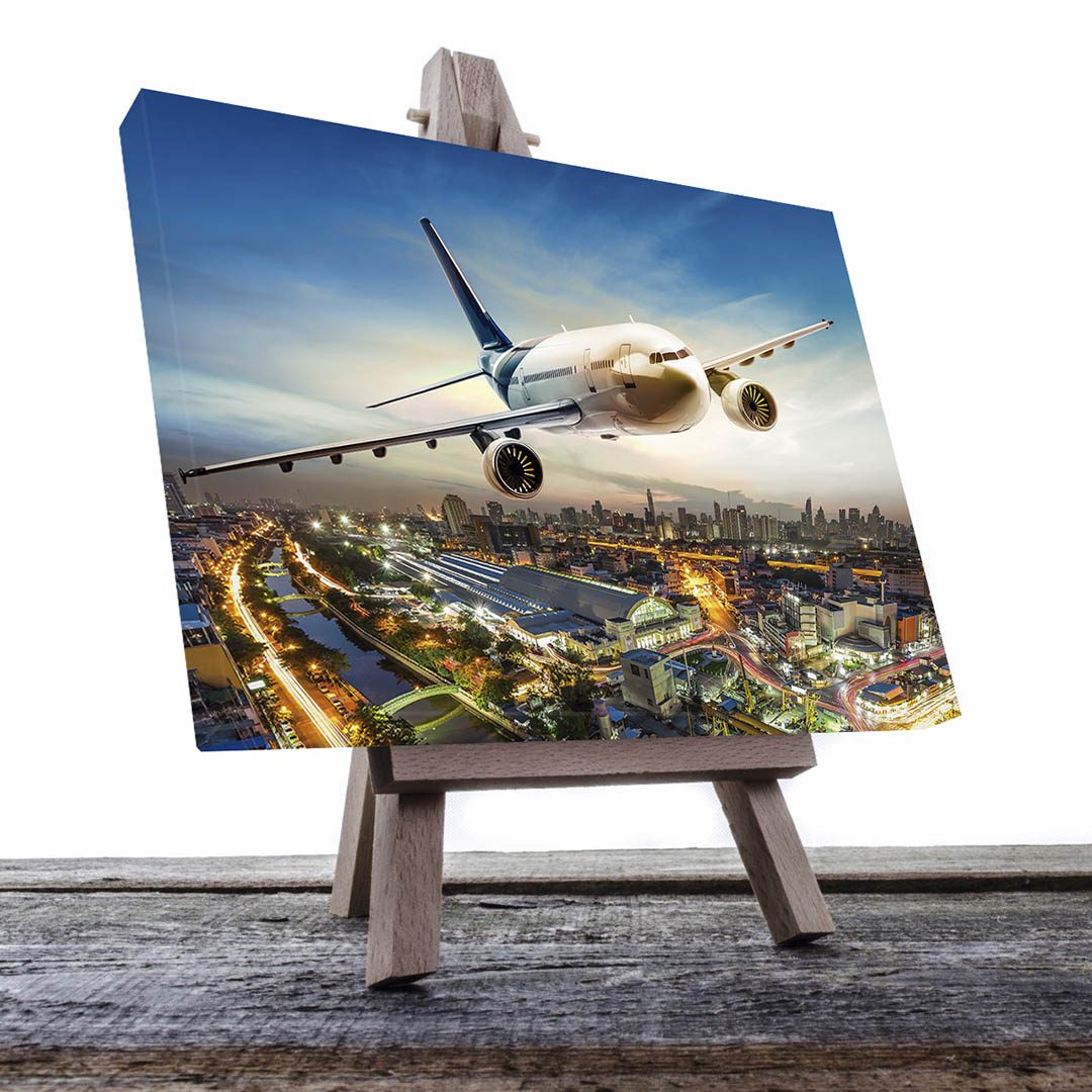 Cuadro Decorativo Avión volando sobre la ciudad 90 X 45