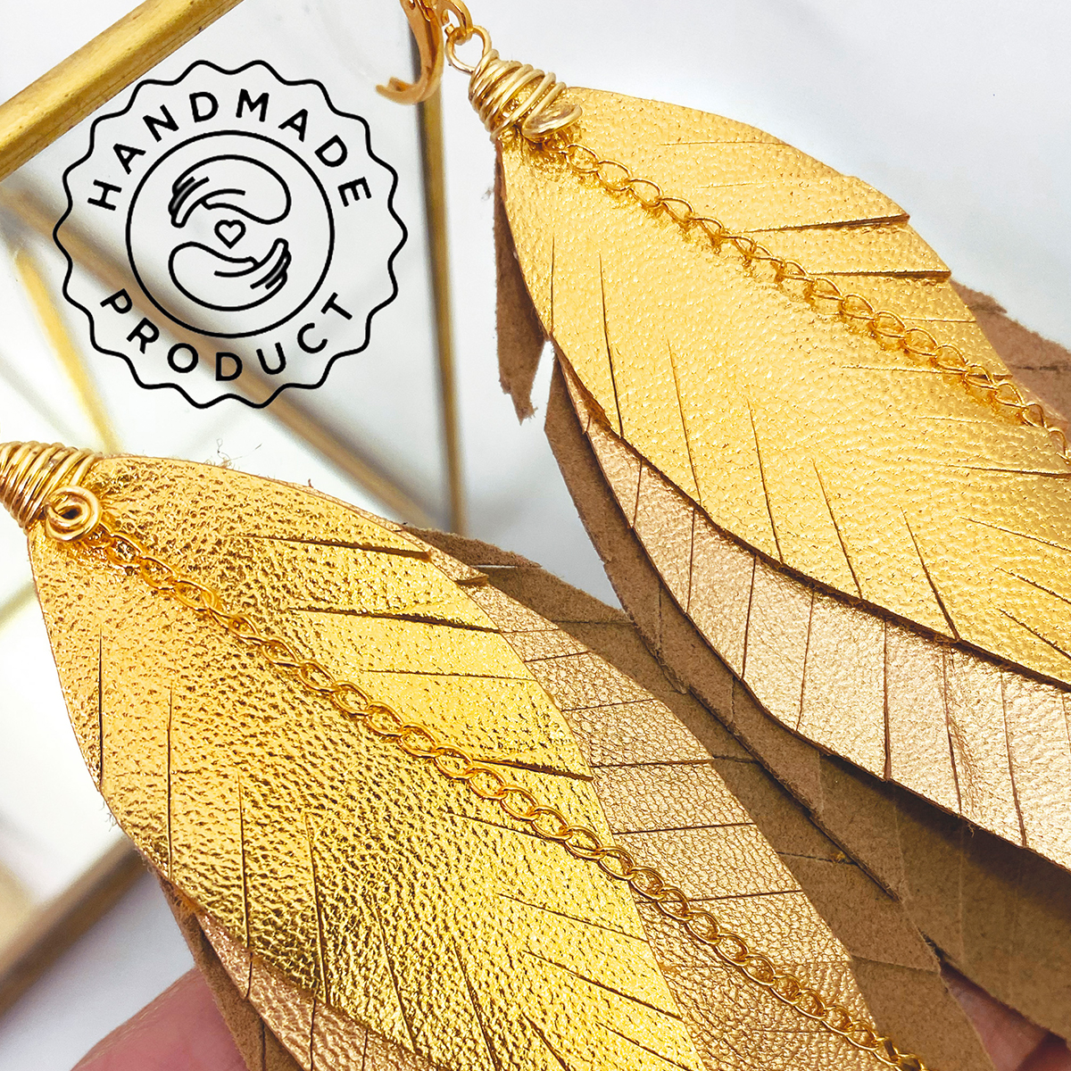 Aretes largos mujer de plumas GAVILÁN joyería VANGANIA